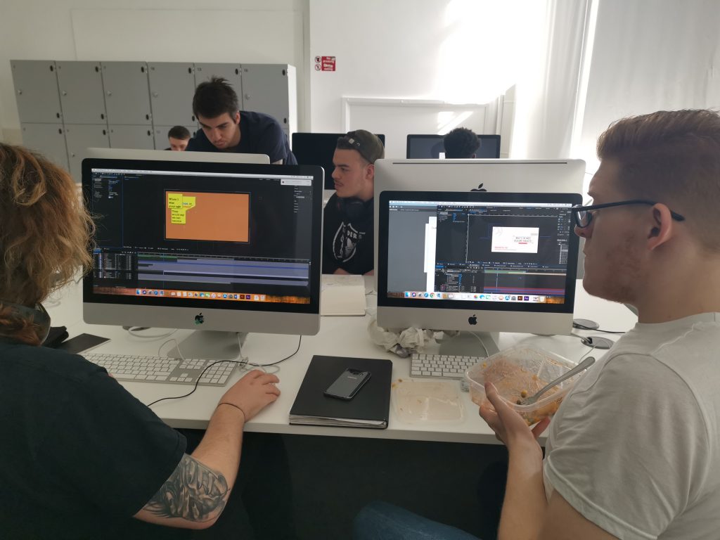 First year students helping each other whilst working on motion graphics projects in GD Studio 1.