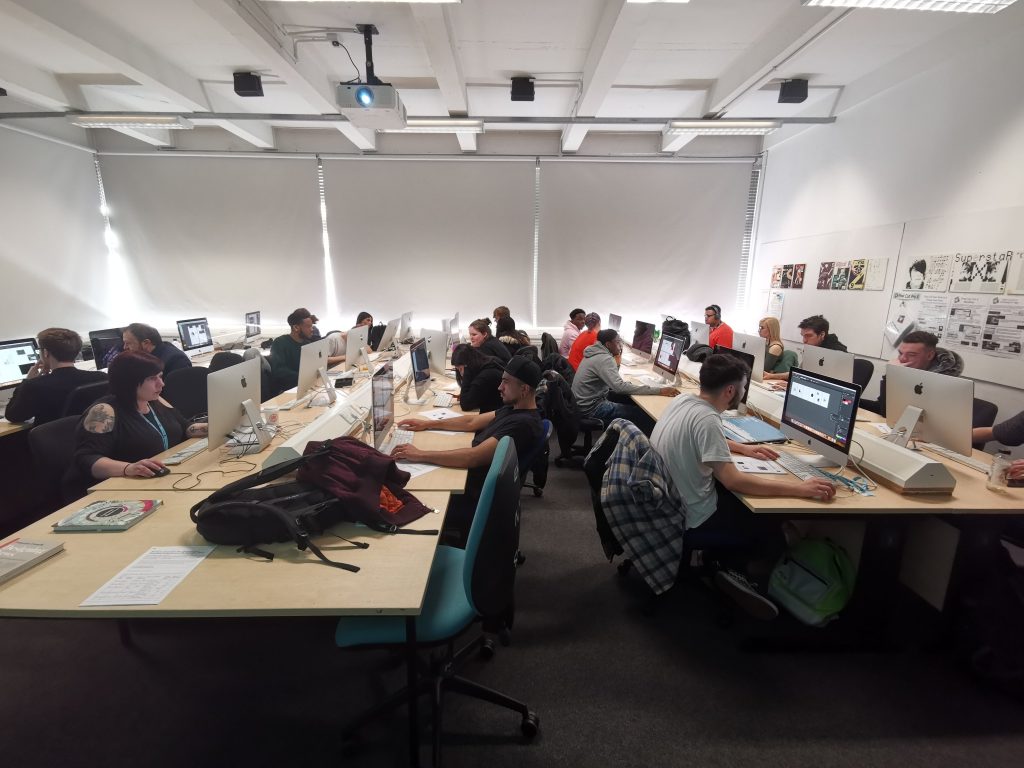 Second-year students designing information graphics in the WLV GD Mac Lab
