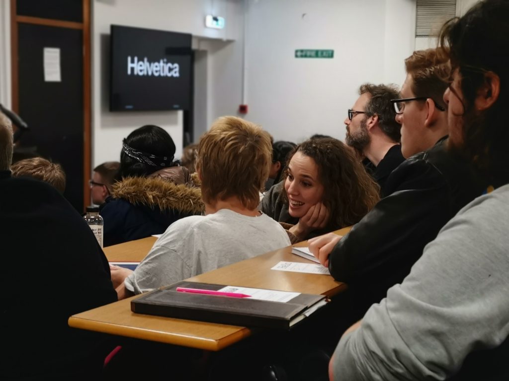 Students enjoying discussions during a typography lecture